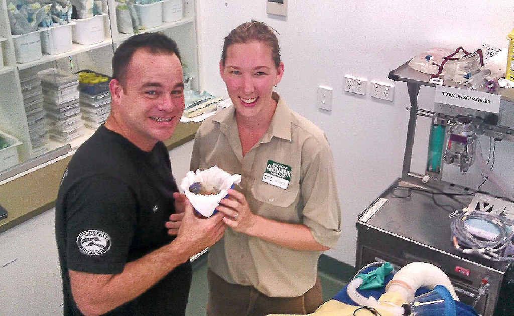 Kenton Campbell and senior vet nurse Patricia Swift with a rainbow lorikeet.